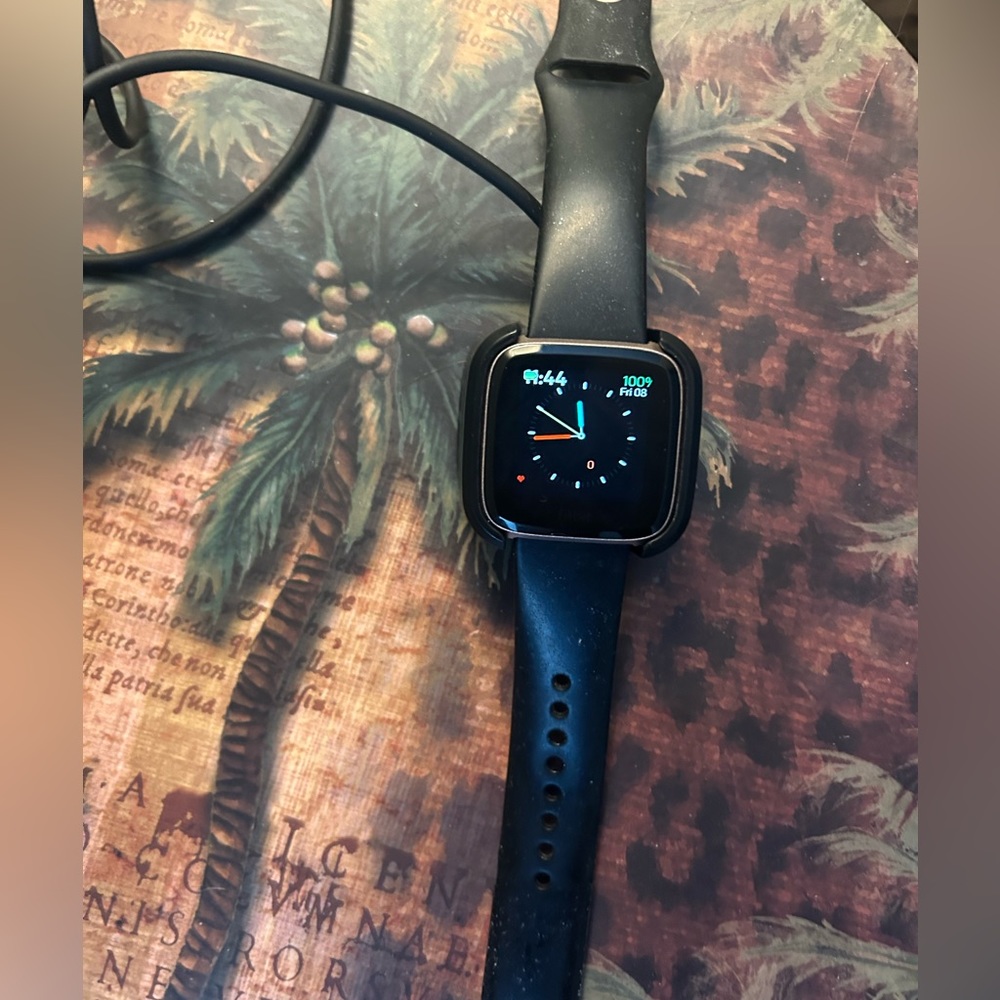 Fitbit Versa with rose tone finish used but in excellent condition